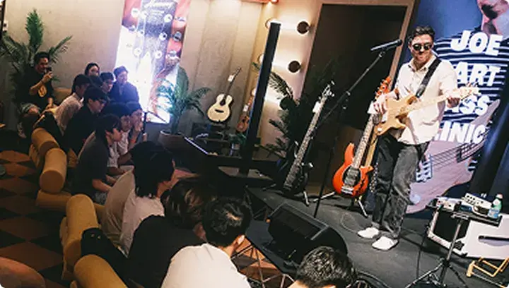 A guitar performance in front of a crowd