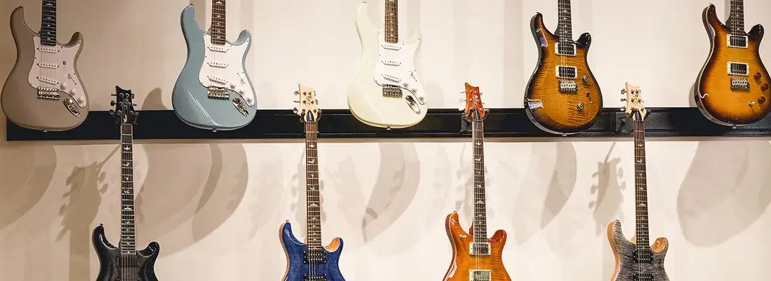 Multiple guitars on display
